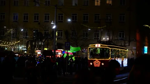 Christmas parade featuring festive tram and crowd. Video stock 333040579