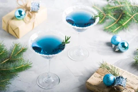 Christmas party composition with drinks gift boxes in blue colors Stock Photos