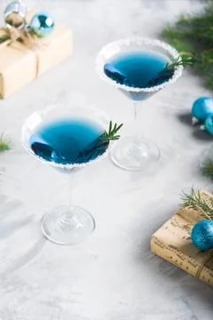 Christmas party composition with drinks gift boxes in blue colors Stock Photos