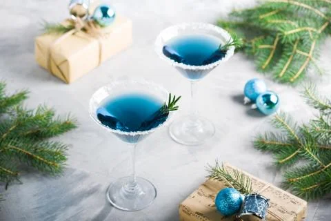 Christmas party composition with drinks gift boxes in blue colors Stock Photos