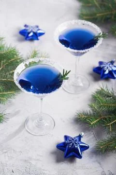 Christmas party composition with two drinks in blue colors snow Stock Photos