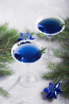 Christmas party composition with two drinks in blue colors snow Foto stock