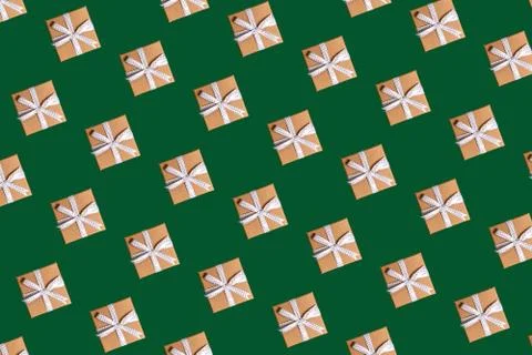 Christmas pattern craft gift boxes on green background Stock Photos