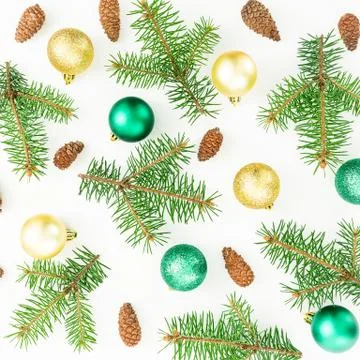 Christmas pattern of evergreen trees and shiny decoration on white background Stock Photos