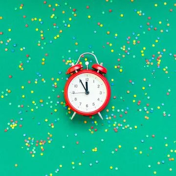 Christmas pattern flat lay with red alarm clock Stock Photos