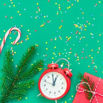 Christmas pattern flat lay with red alarm clock Stock Photos