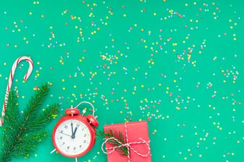 Christmas pattern flat lay with red alarm clock Stock Photos
