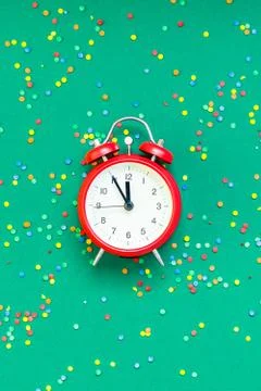 Christmas pattern flat lay with red alarm clock Stock Photos