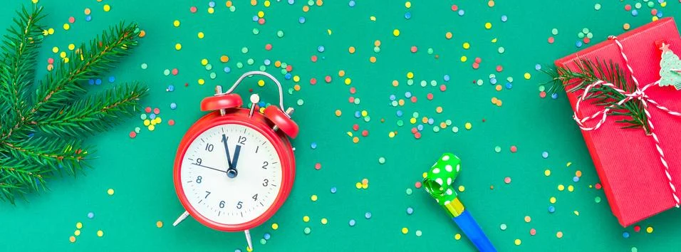 Christmas pattern flat lay with red alarm clock Stock Photos