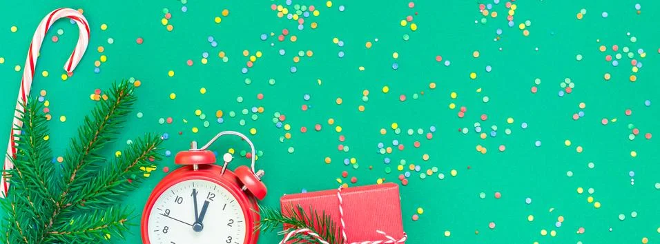 Christmas pattern flat lay with red alarm clock Stock Photos