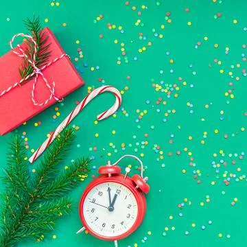 Christmas pattern flat lay with red alarm clock Stock Photos