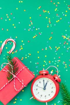 Christmas pattern flat lay with red alarm clock Stock Photos