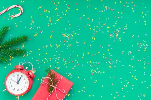 Christmas pattern flat lay with red alarm clock Stock Photos