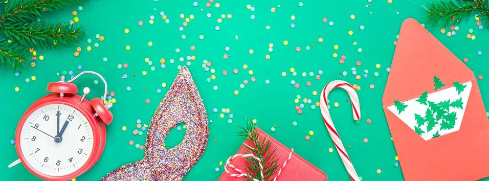 Christmas pattern flat lay with red alarm clock Stock Photos