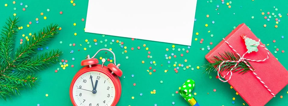 Christmas pattern flat lay with red alarm clock Stock Photos