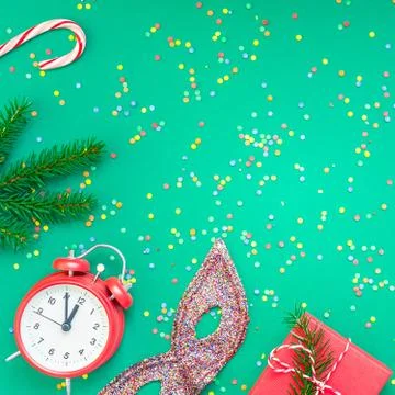 Christmas pattern flat lay with red alarm clock Stock Photos