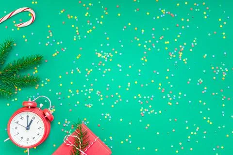 Christmas pattern flat lay with red alarm clock Stock Photos