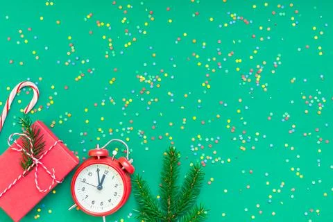 Christmas pattern flat lay with red alarm clock Stock Photos