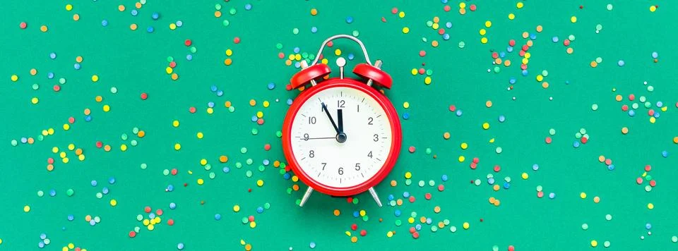 Christmas pattern flat lay with red alarm clock Stock Photos
