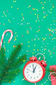 Christmas pattern flat lay with red alarm clock Stock Photos
