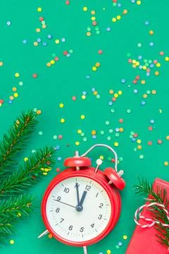 Christmas pattern flat lay with red alarm clock Stock Photos