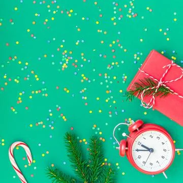 Christmas pattern flat lay with red alarm clock Stock Photos