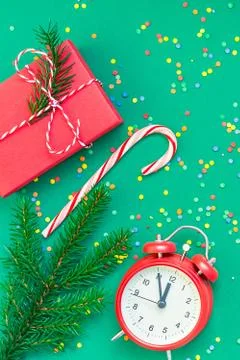 Christmas pattern flat lay with red alarm clock Stock Photos