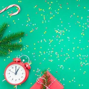 Christmas pattern flat lay with red alarm clock Stock Photos