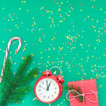 Christmas pattern flat lay with red alarm clock Stock Photos