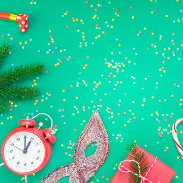 Christmas pattern flat lay with red alarm clock Stock Photos