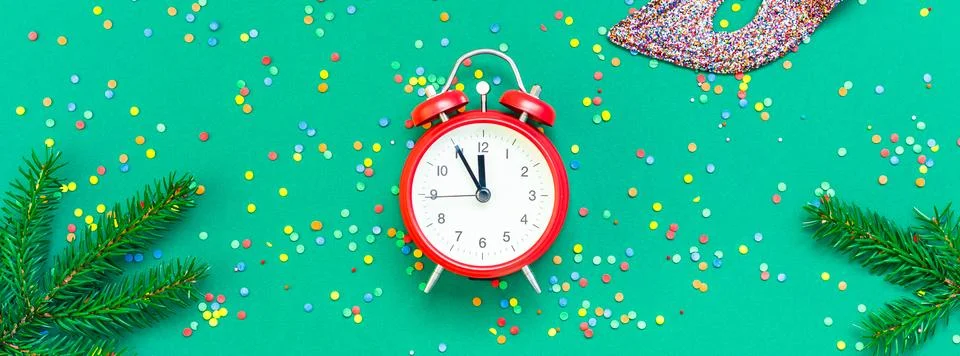 Christmas pattern flat lay with red alarm clock Stock Photos