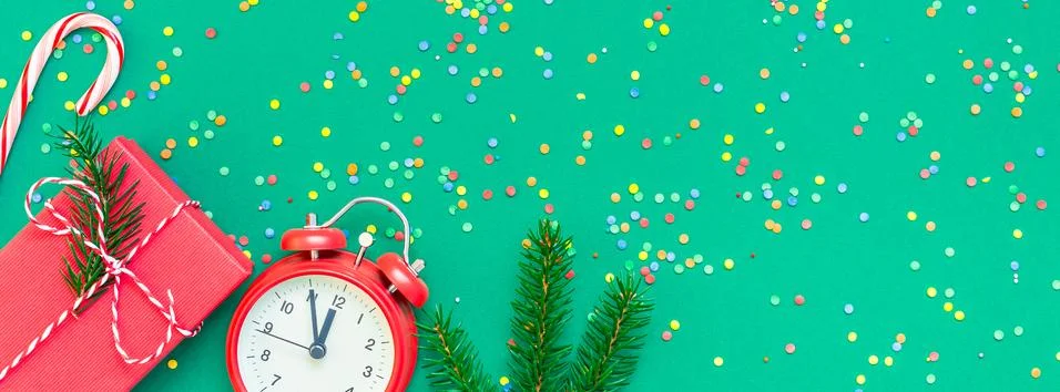 Christmas pattern flat lay with red alarm clock Stock Photos