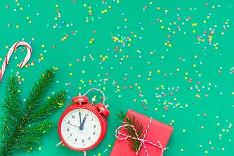 Christmas pattern flat lay with red alarm clock Stock Photos