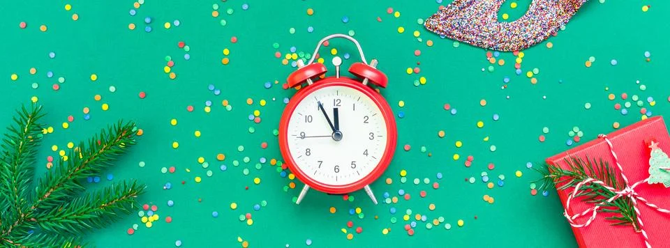 Christmas pattern flat lay with red alarm clock Stock Photos
