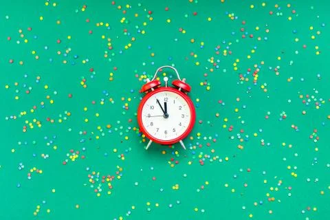 Christmas pattern flat lay with red alarm clock Stock Photos