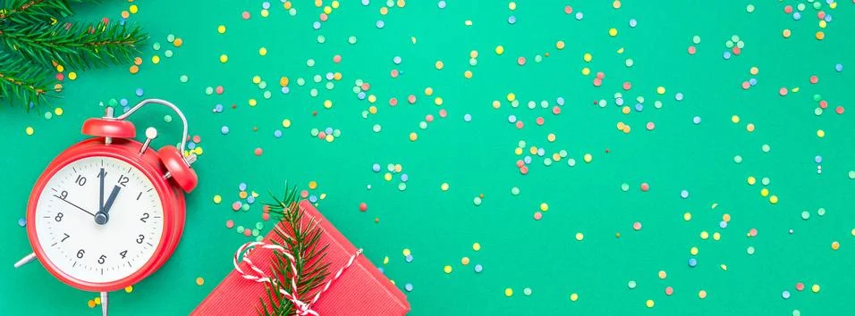 Christmas pattern flat lay with red alarm clock Stock Photos