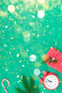 Christmas pattern flat lay with red alarm clock Stock Photos