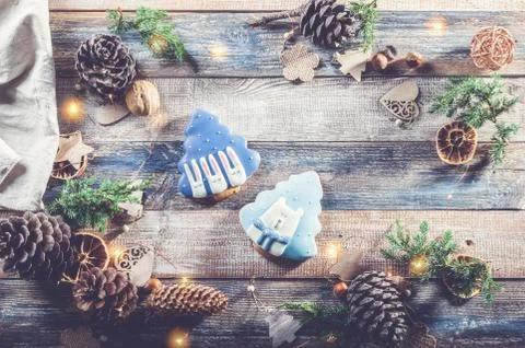 Christmas pattern with gingerbread, juniper twigs, toys and decorations made Stock Photos