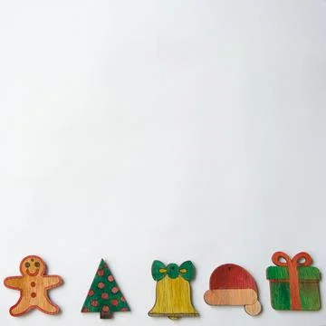 Christmas pattern with gingerbread man, tree, bell, santa hat and a gift Stock Photos