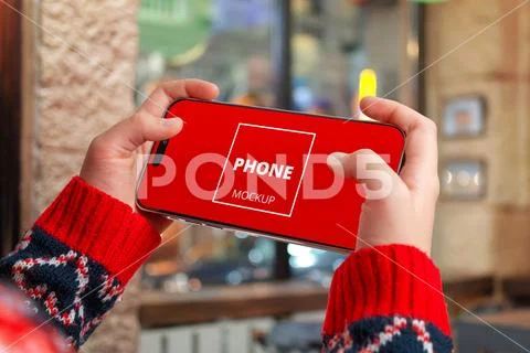Christmas phone mockup in gaming grip PSD Template