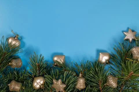 Christmas pine branches decorating blue background for holiday season Stock Photos