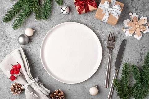Christmas place setting on gray table. Stock Photos