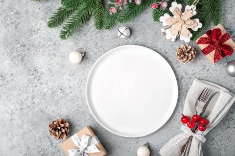 Christmas place setting on gray table. Stock Photos