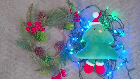 Christmas plush tree toy with pine wreath and glowing garland Stock-Footage 341660738