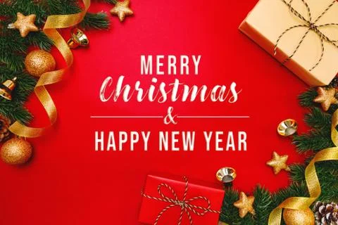 Christmas present and pine tree with xmas decoration on Red background Stock Photos