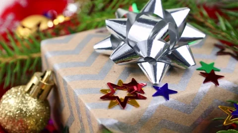 Christmas present box with decorations and fir tree branches circle rotation Stock Footage 290867972