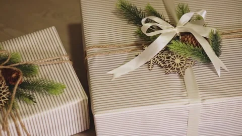 Christmas Present Boxes Wrapped With Rustic Aesthetic Natural Elements. Tracking Stock Footage 332938050