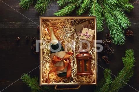 Christmas present with champagne bottle Stock Photos