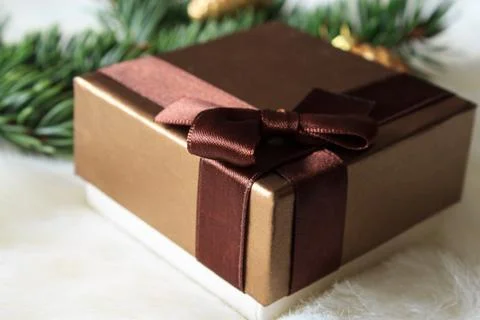 Christmas present on a light background. Close-up. Stock Photos