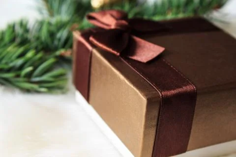 Christmas present on a light background. Close-up. Stock Photos